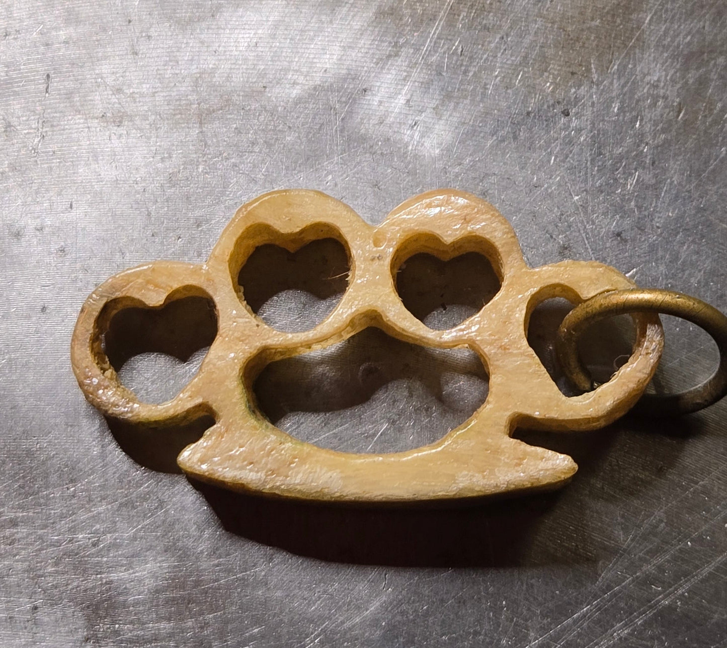 Hand-Carved Human Bone Mini Brass Knuckles – Heart Cutouts