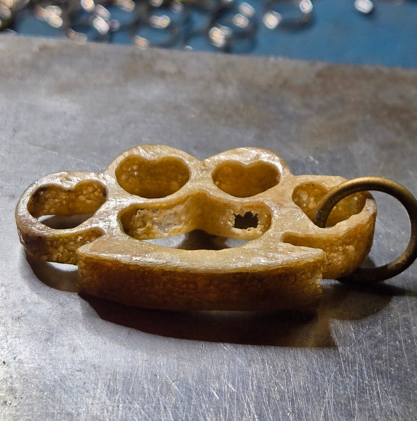 Hand-Carved Human Bone Mini Brass Knuckles – Heart Cutouts