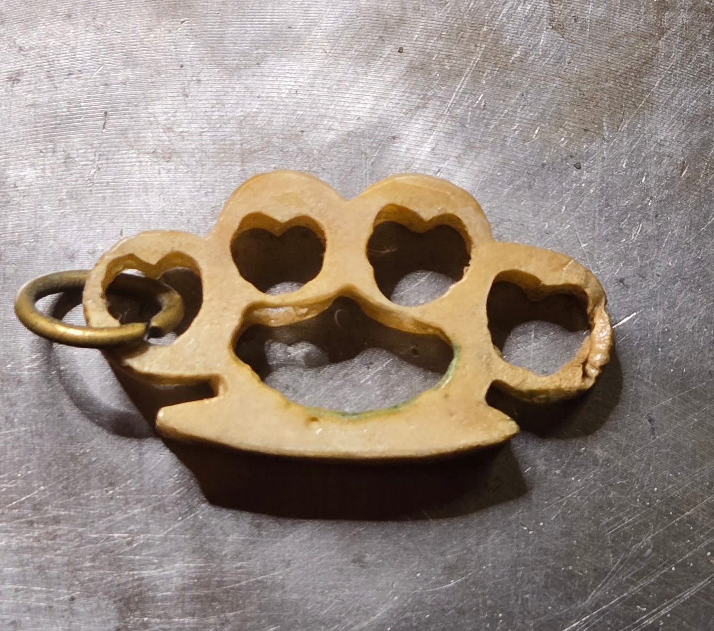 Hand-Carved Human Bone Mini Brass Knuckles – Heart Cutouts